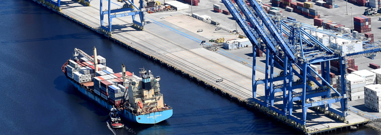 Prompt Towing Service conducting heavy duty accident recovery near the Main Gate on Burnett Blvd in Wilmington NC. Rotator wreckers upright and tow overturned tractor trailers to keep port traffic flowing.