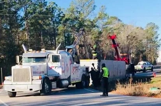 Prompt Towing Service performing bus recovery and transport near the Port of Wilmington Main Gate on Burnett Blvd. Fast, safe heavy duty response.