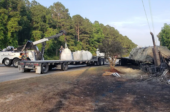 Container truck rollover recovery near the Port of Wilmington Main Gate on Burnett Blvd handled by Prompt Towing’s rotator team.