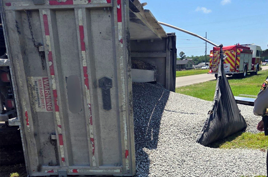 Semi truck receiving a jump start from Prompt Towing near BP Truck Stop on US-117.