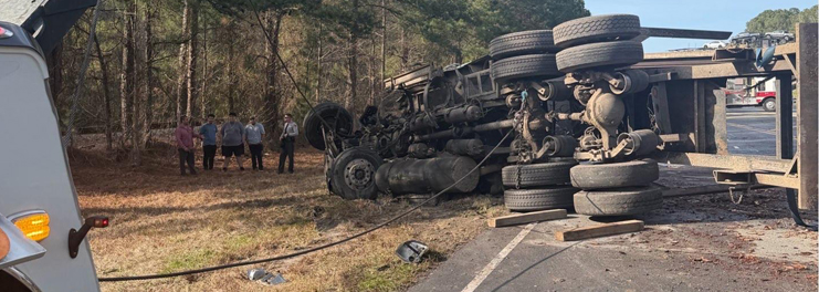 Semi truck being winched out from roadside near NC-24 in Warsaw North Carolina